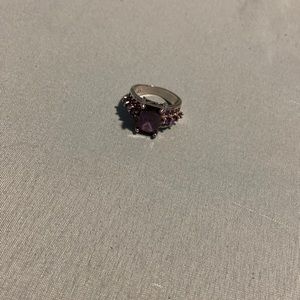 a sterling silver diamond purple gem stone.